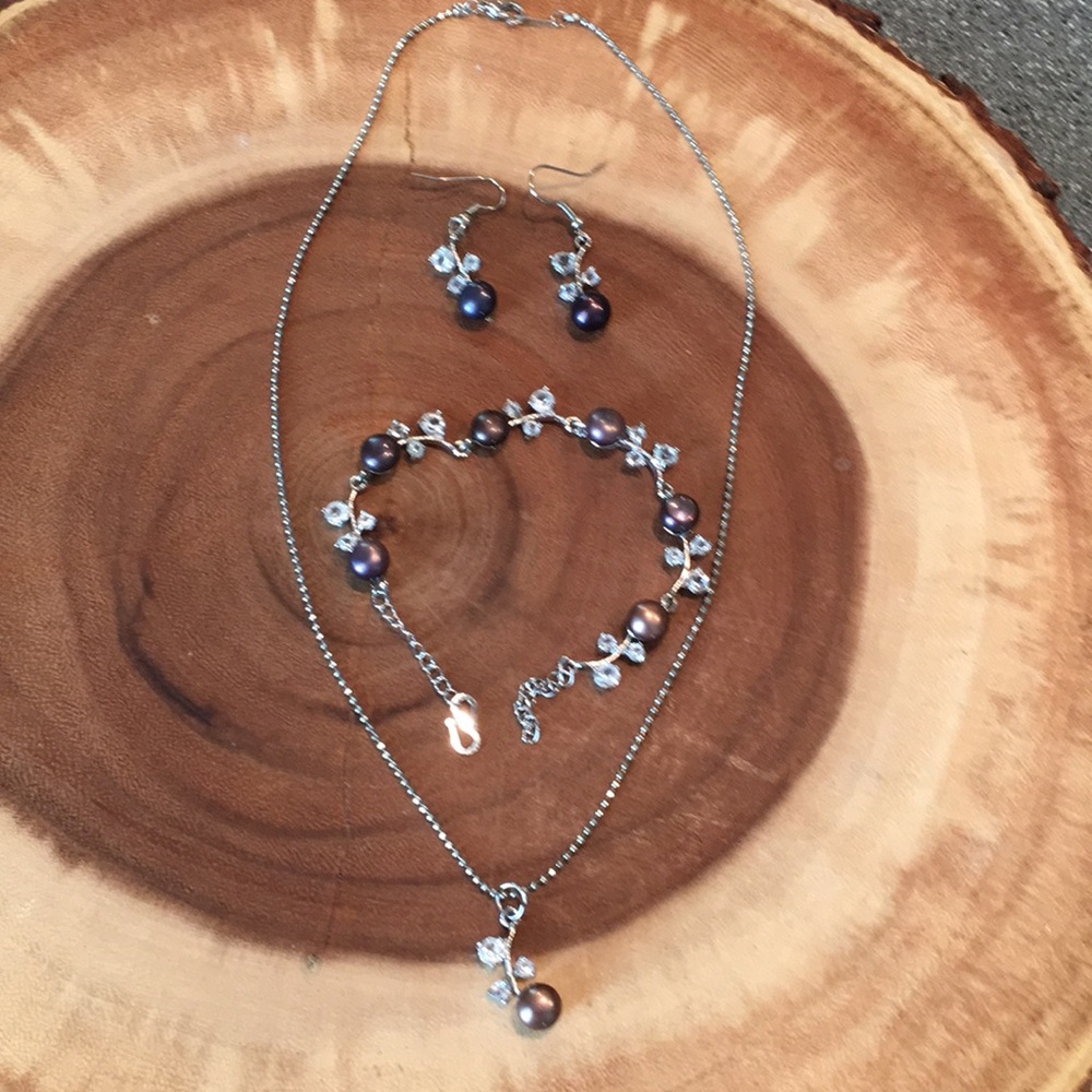 Matching necklace, bracelet, and earrings